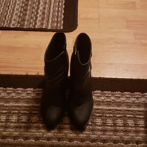 Short heel boots with a buckle heal design.